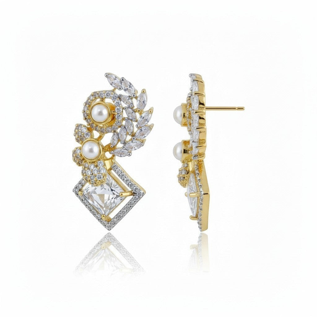 AVIRI elegant gold drop earrings with pearls, cubic zirconia, and leaf motifs. Features geometric design and diamond-shaped center.