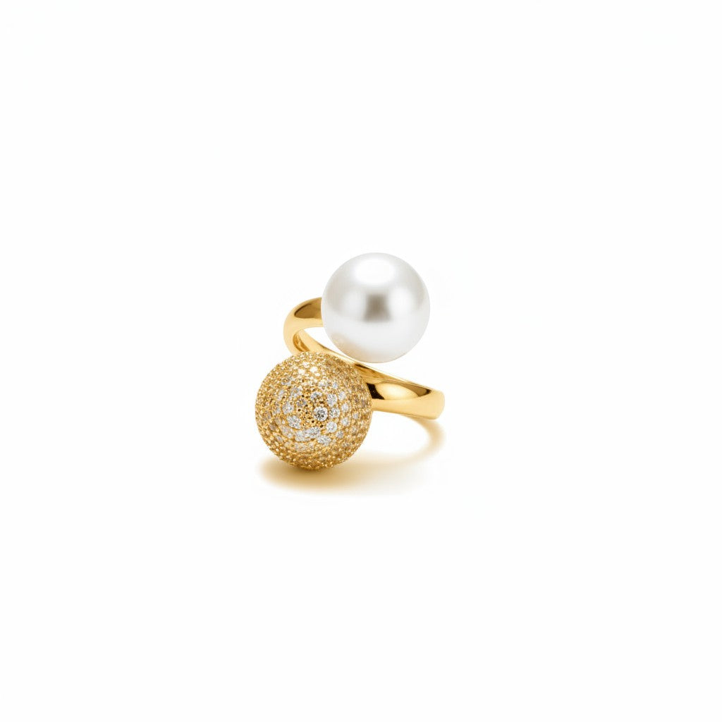 AVIRI gold polish statement ring with a pearl and a pave diamond sphere.