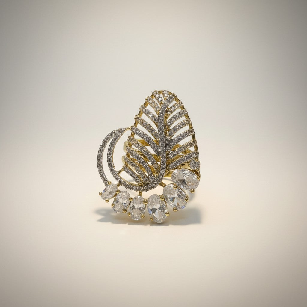 AVIRI gold-plated statement ring with leaf design and American diamonds. Features oval-cut stones.