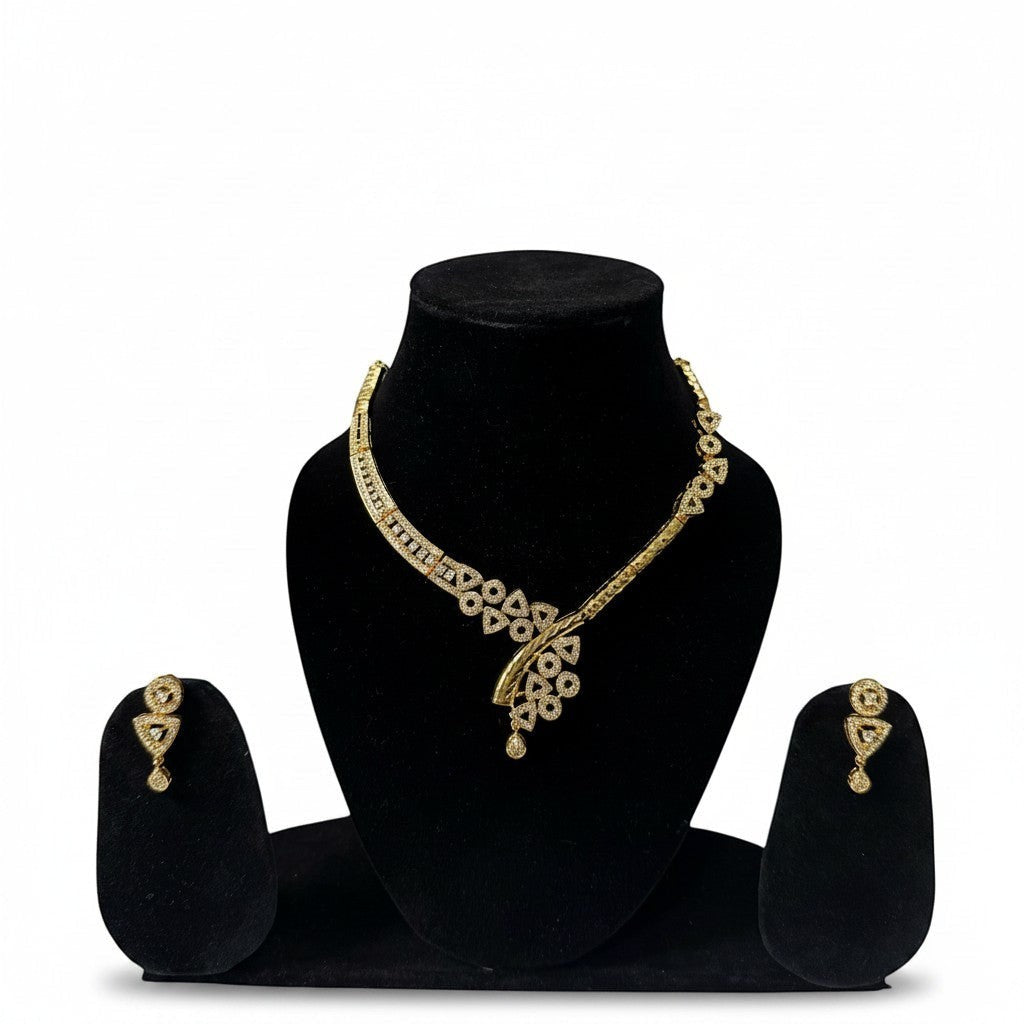 AVIRI gold-plated necklace and earring set with cubic zirconia stones. Geometric patterns and teardrop pendant.