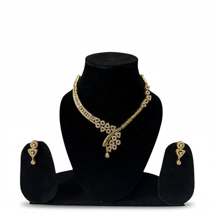 AVIRI gold-plated necklace and earring set with cubic zirconia stones. Geometric patterns and teardrop pendant.