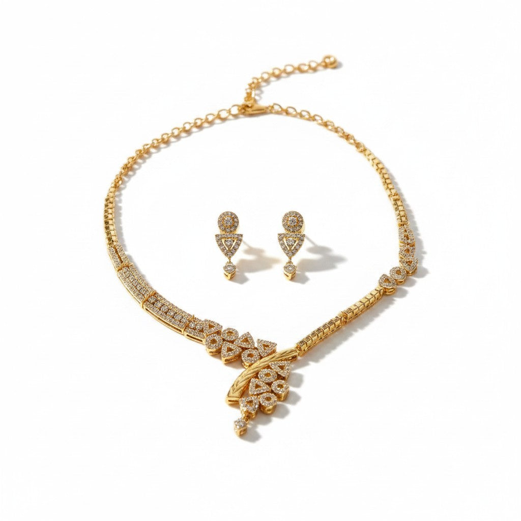AVIRI gold-plated necklace and earring set with cubic zirconia stones and teardrop pendant. Geometric design.