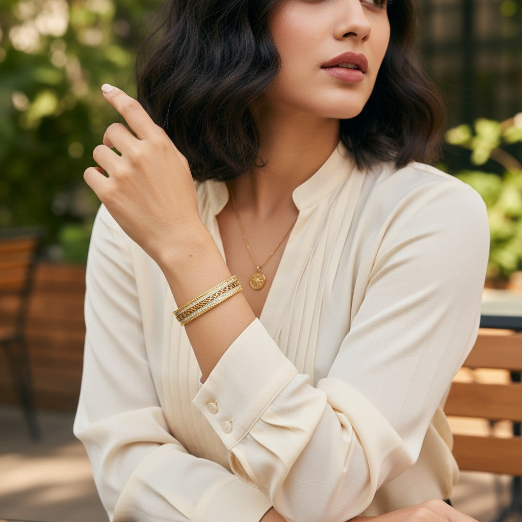 AVIRI gold-plated ornate bangles with cubic zirconia and intricate swirling patterns, beaded edges.