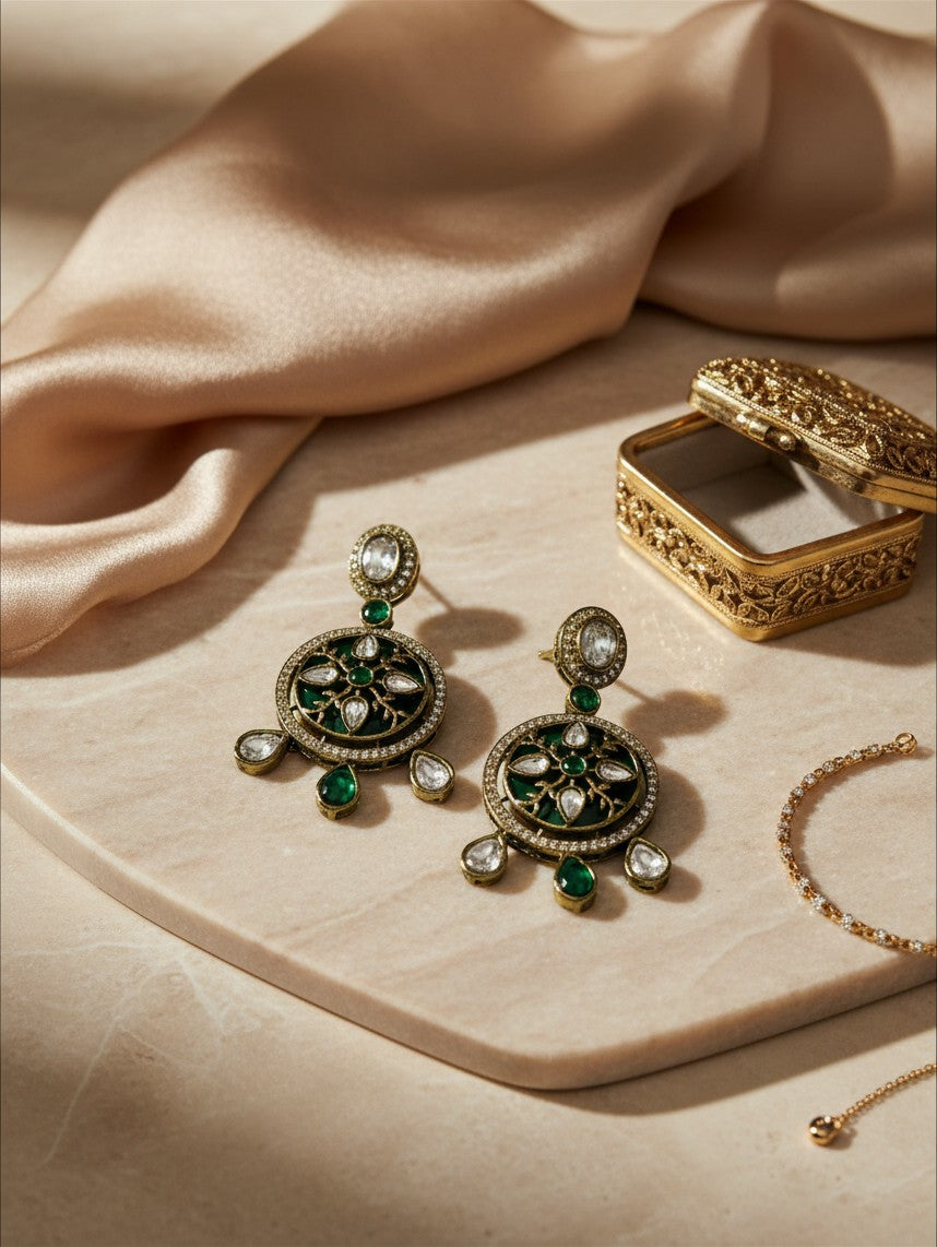 AVIRI traditional ethnic drop earrings featuring deep green enamel, white stones, and antique gold-tone metalwork.