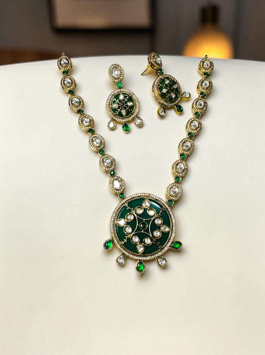 AVIRI traditional jewelry set with deep green enamel, white stones, and antique gold-tone finish necklace and earrings.