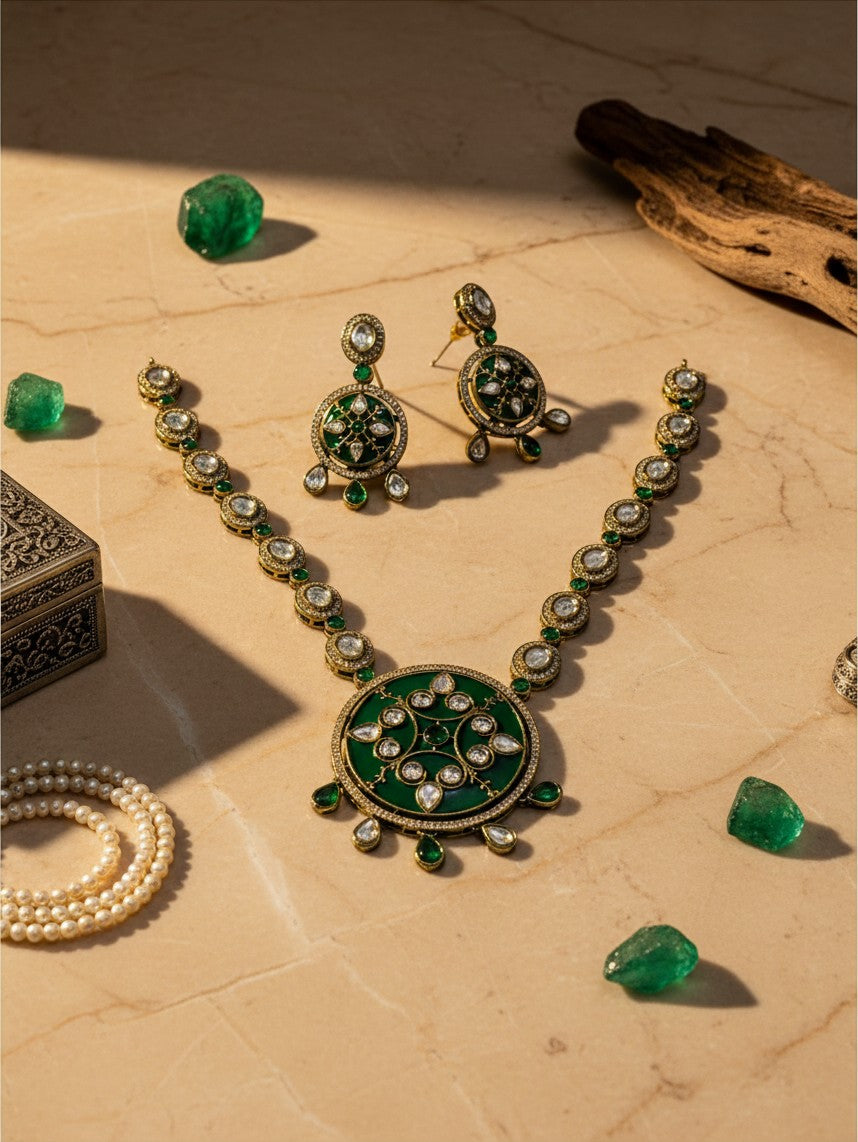 AVIRI traditional jewelry set with green enamel circular pendant necklace and matching drop earrings in antique gold.
