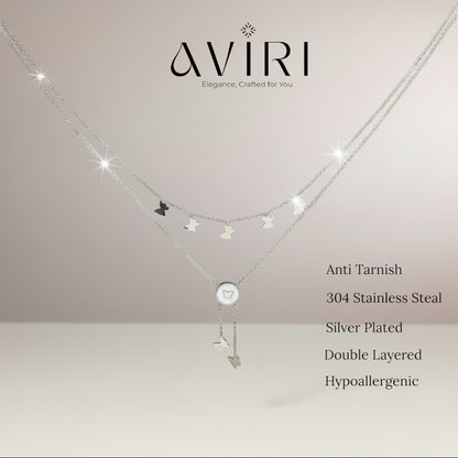 AVIRI silver layered necklace with butterfly charms and a circular pendant.