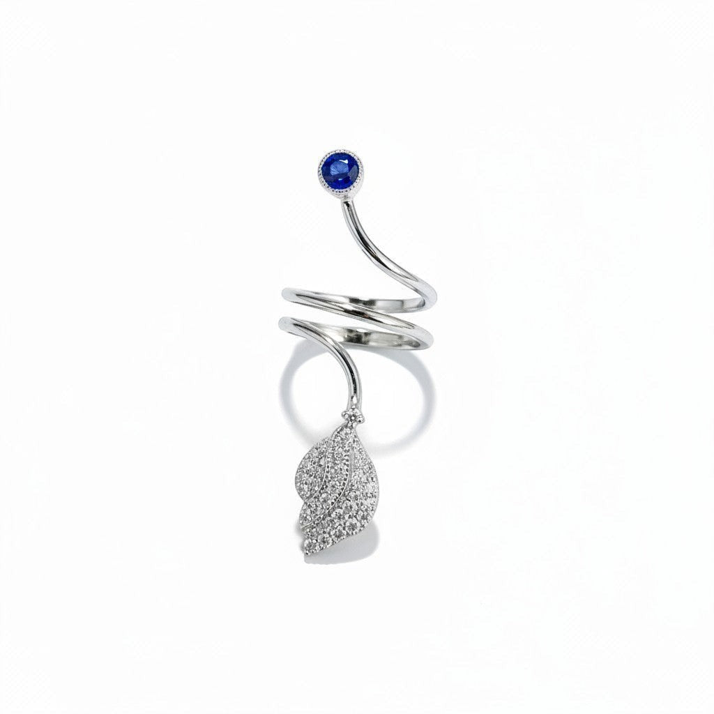 AVIRI sterling silver bypass ring with leaf motif, cubic zirconia, and blue gemstone.