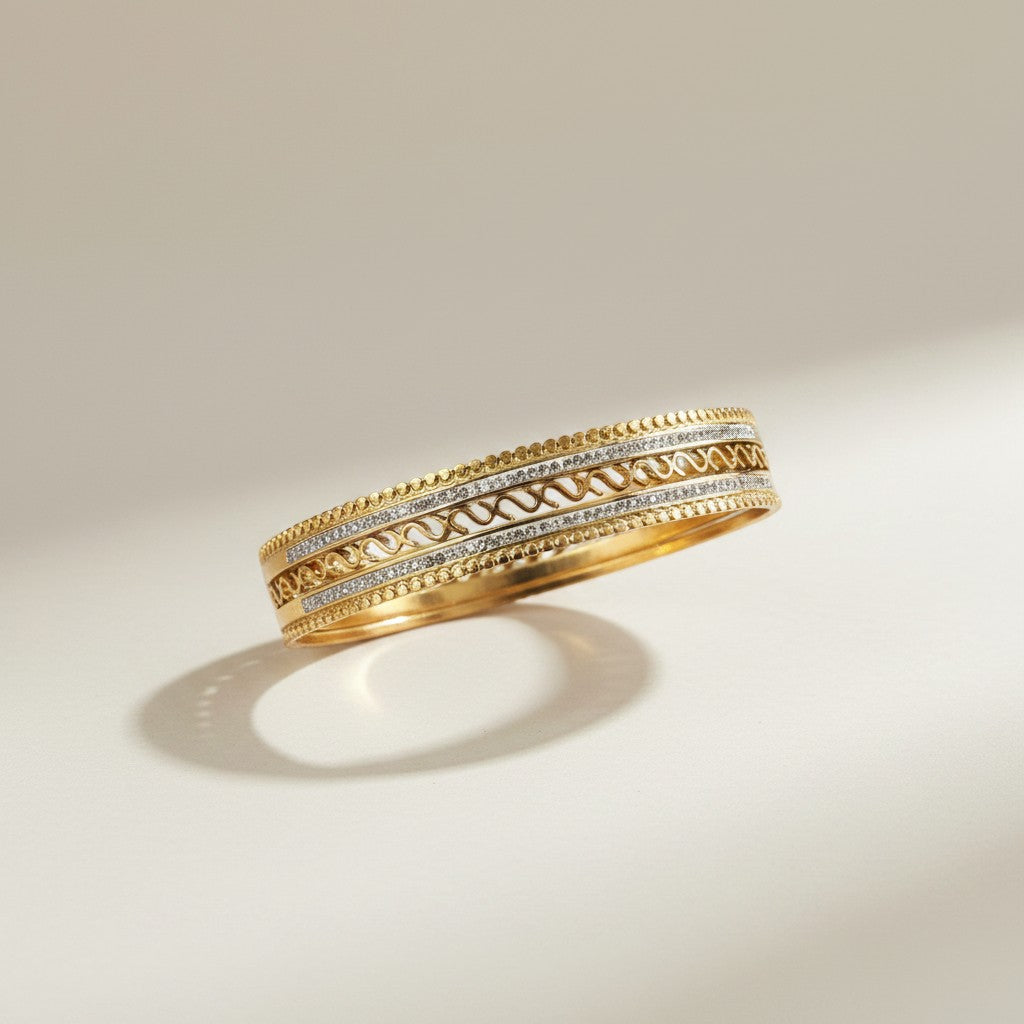 AVIRI gold-plated ornate bangles with cubic zirconia and beaded edges, perfect for festive occasions.