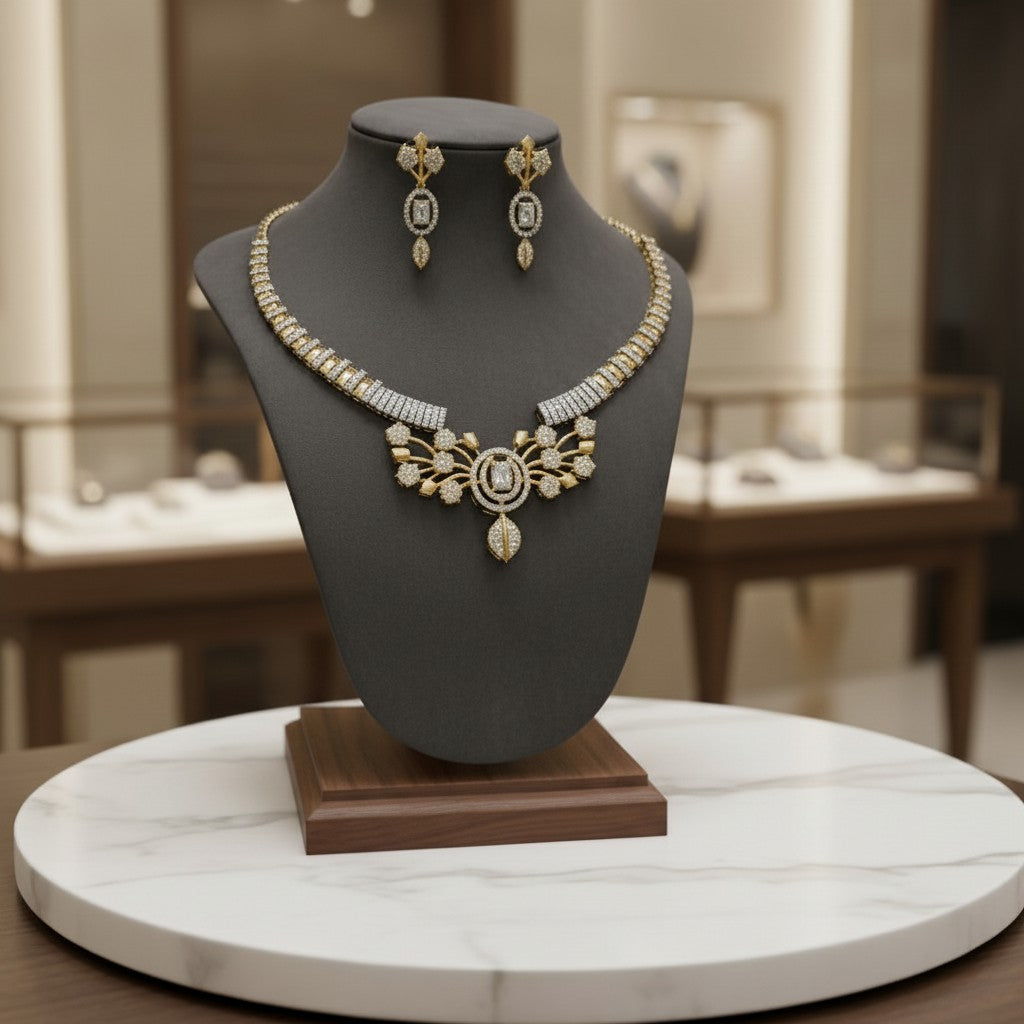 AVIRI gold-plated necklace and earring set with cubic zirconia stones, featuring leaf motifs and intricate detailing.