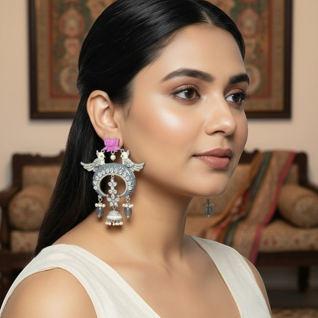 AVIRI oxidised silver chandbali earrings with pink lotus, AD stones, and grey jhumka drops.