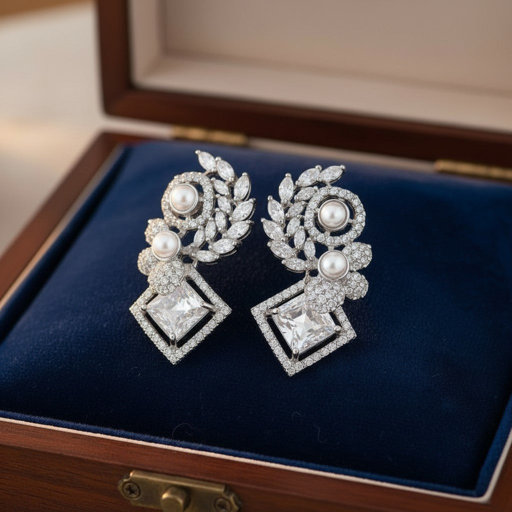 AVIRI sterling silver drop earrings with pearls, cubic zirconia, leaf motifs and blue enamel accents.