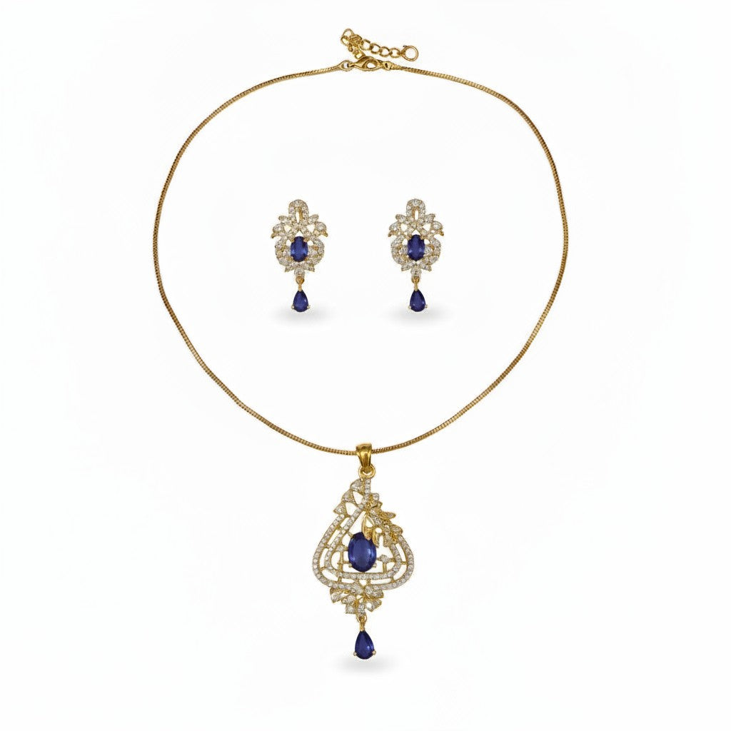 AVIRI gold-tone pendant necklace and earring set with purple teardrop cubic zirconia stones and intricate detailing.