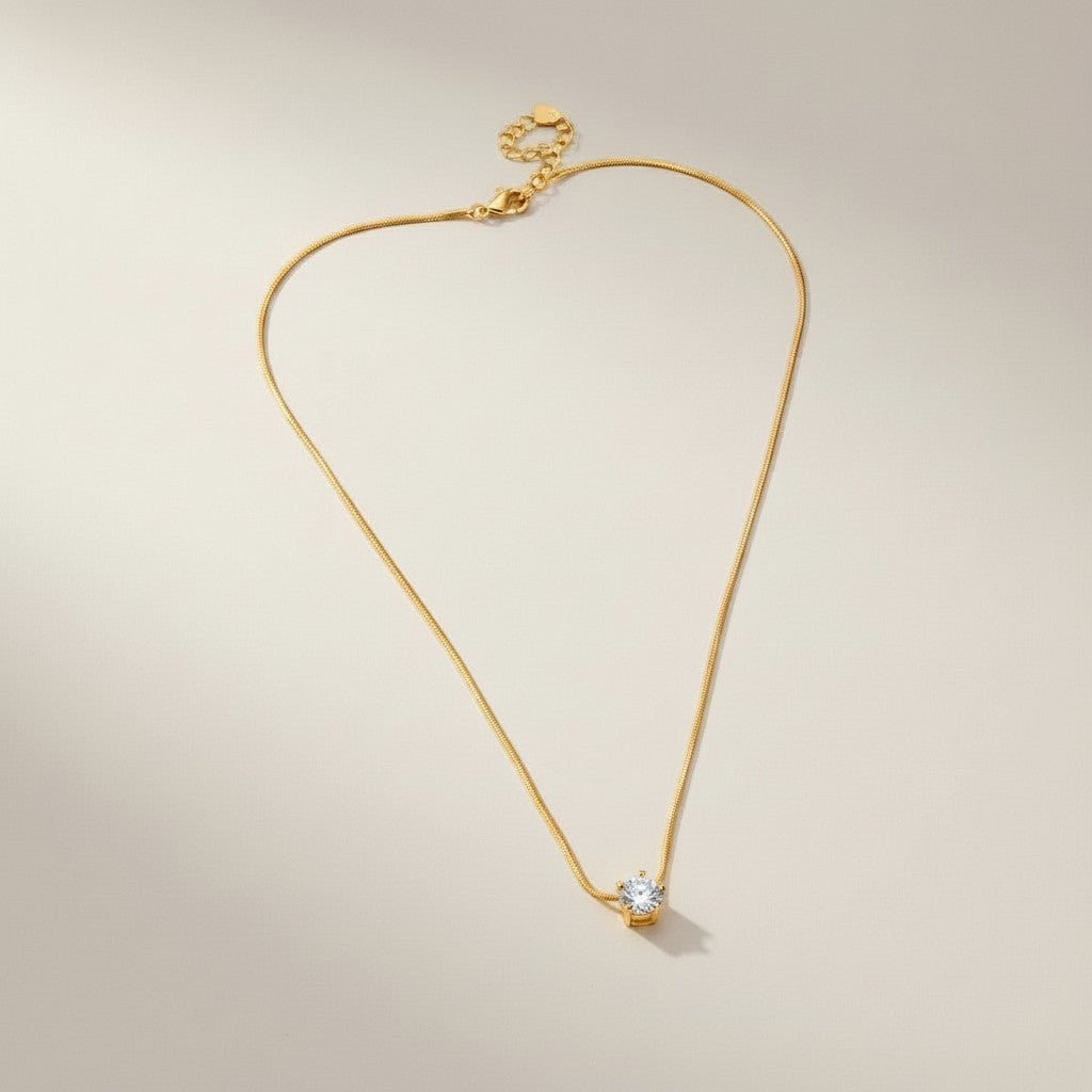 AVIRI rose gold plated solitaire pendant necklace with cubic zirconia on a delicate snake chain.