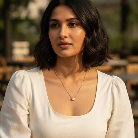 AVIRI rose gold solitaire necklace with a delicate snake chain and sparkling cubic zirconia pendant.
