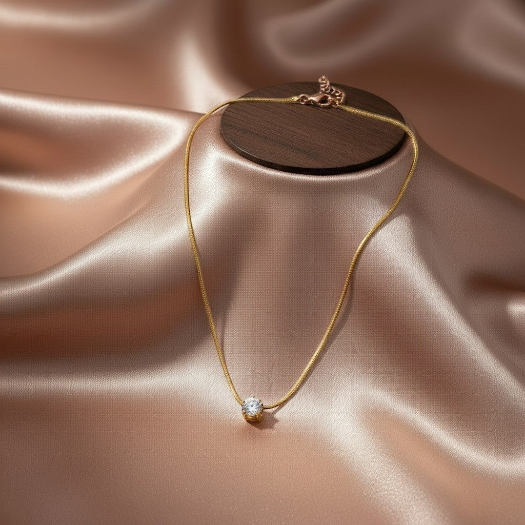 AVIRI rose gold solitaire pendant necklace with a sparkling cubic zirconia on a delicate snake chain.
