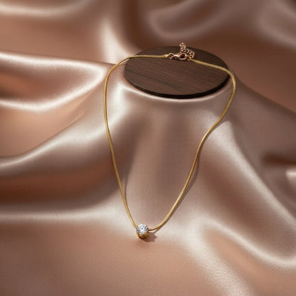 AVIRI rose gold solitaire pendant necklace with a sparkling cubic zirconia on a delicate snake chain.