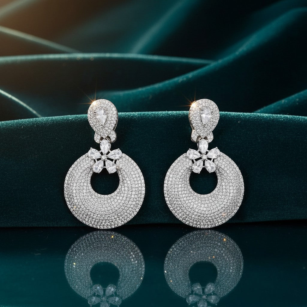AVIRI silver polish dangle earrings with micro AD stones and circular drop design.
