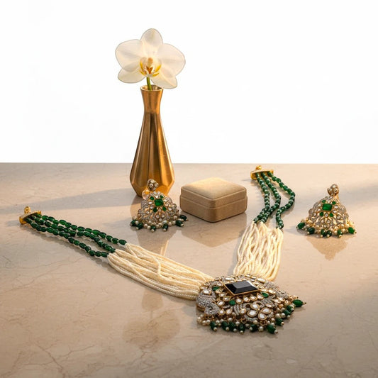 AVIRI statement necklace and earring set with white pearls, emeralds, black onyx, and white stones.