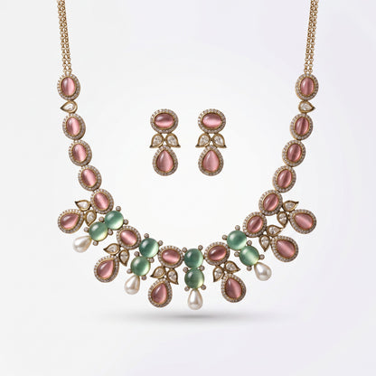 AVIRI traditional necklace and earring set with pink and green cabochon stones, faux pearls, and crystal accents.
