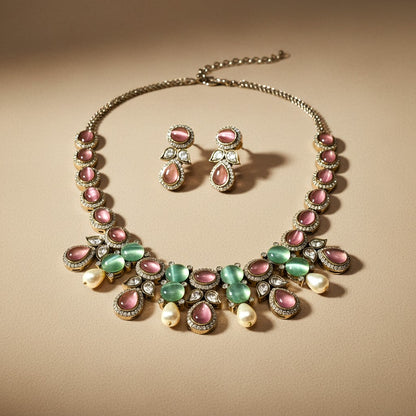 AVIRI traditional necklace and earring set featuring pink and green cabochon stones, faux pearls, and crystal accents.