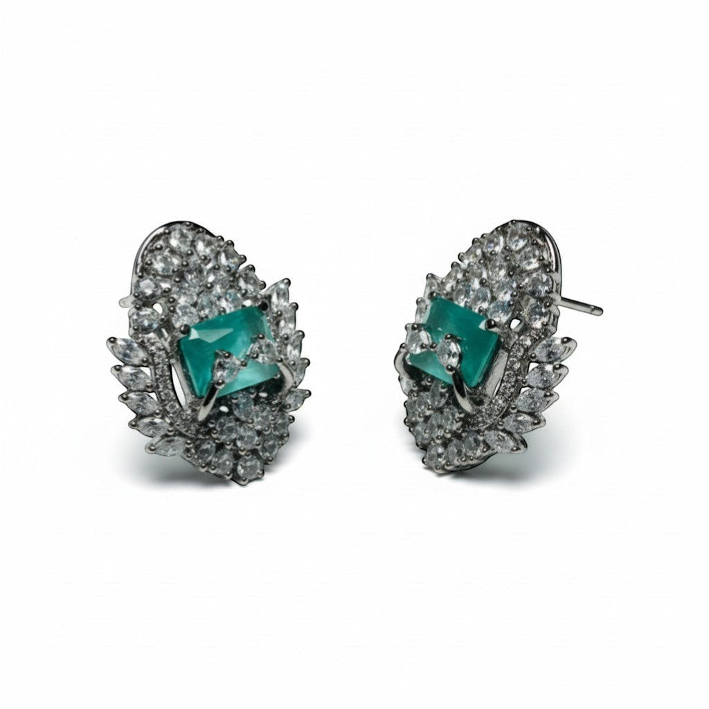 AVIRI luxury teal AD stud earrings with silver polish finish and halo of clear stones.