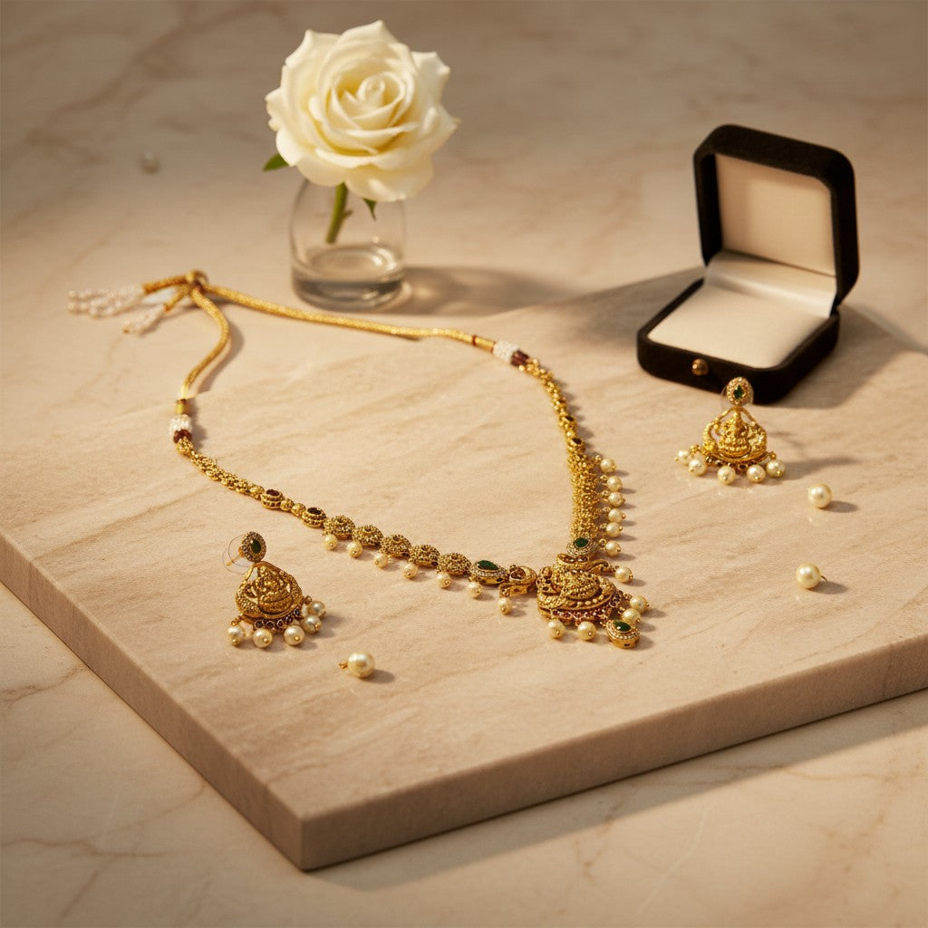 AVIRI traditional gold plated necklace and earring set with green and red stones and pearls.