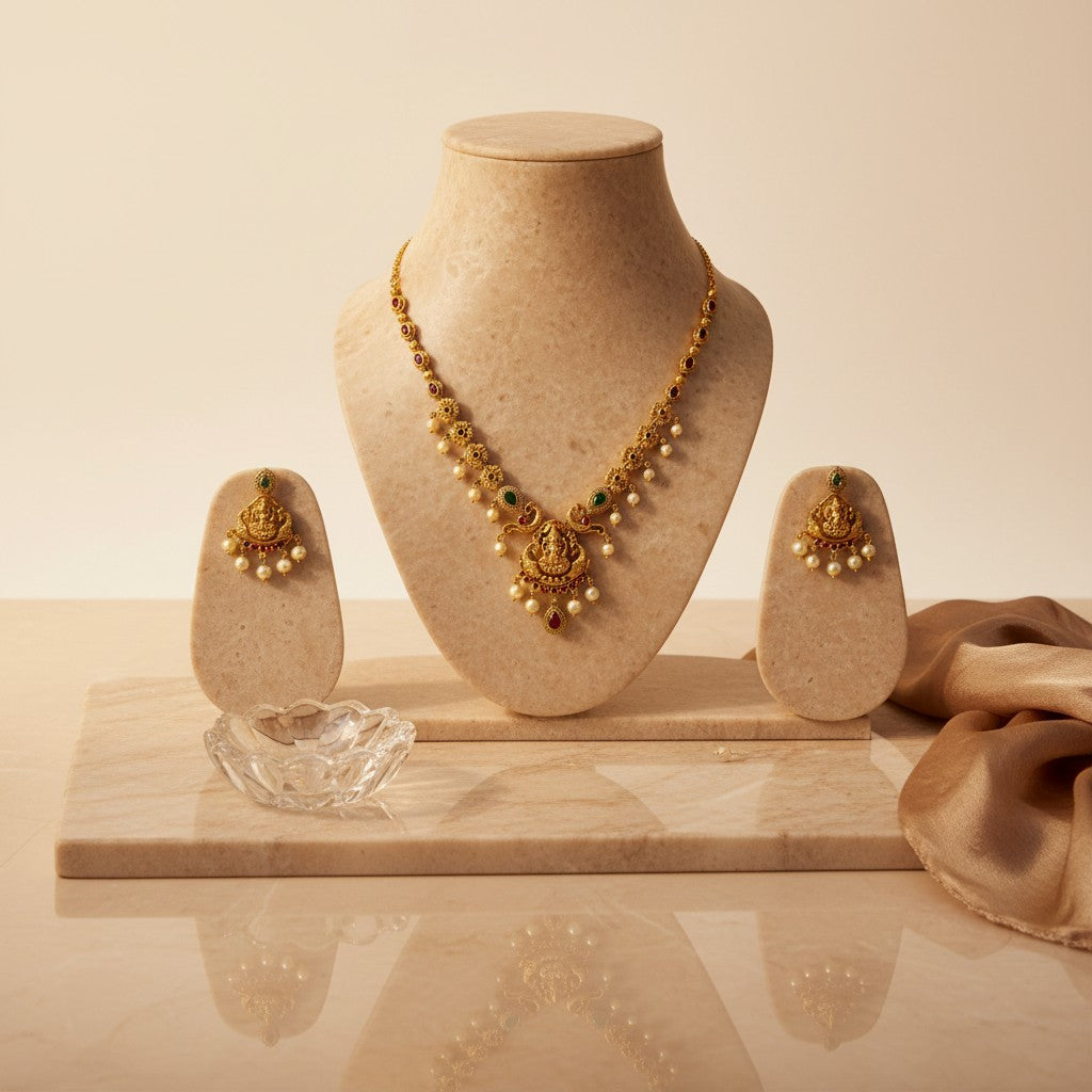 AVIRI traditional gold plated necklace and earring set with green and red stones and pearls.