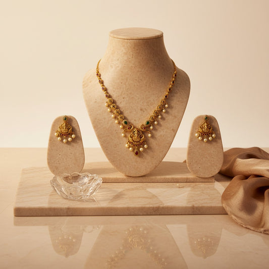 AVIRI traditional gold plated necklace and earring set with green and red stones and pearls.
